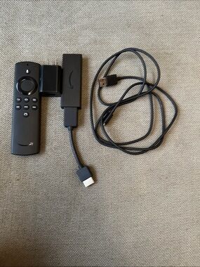 Amazon Fire TV Stick with Black Remote and Cables